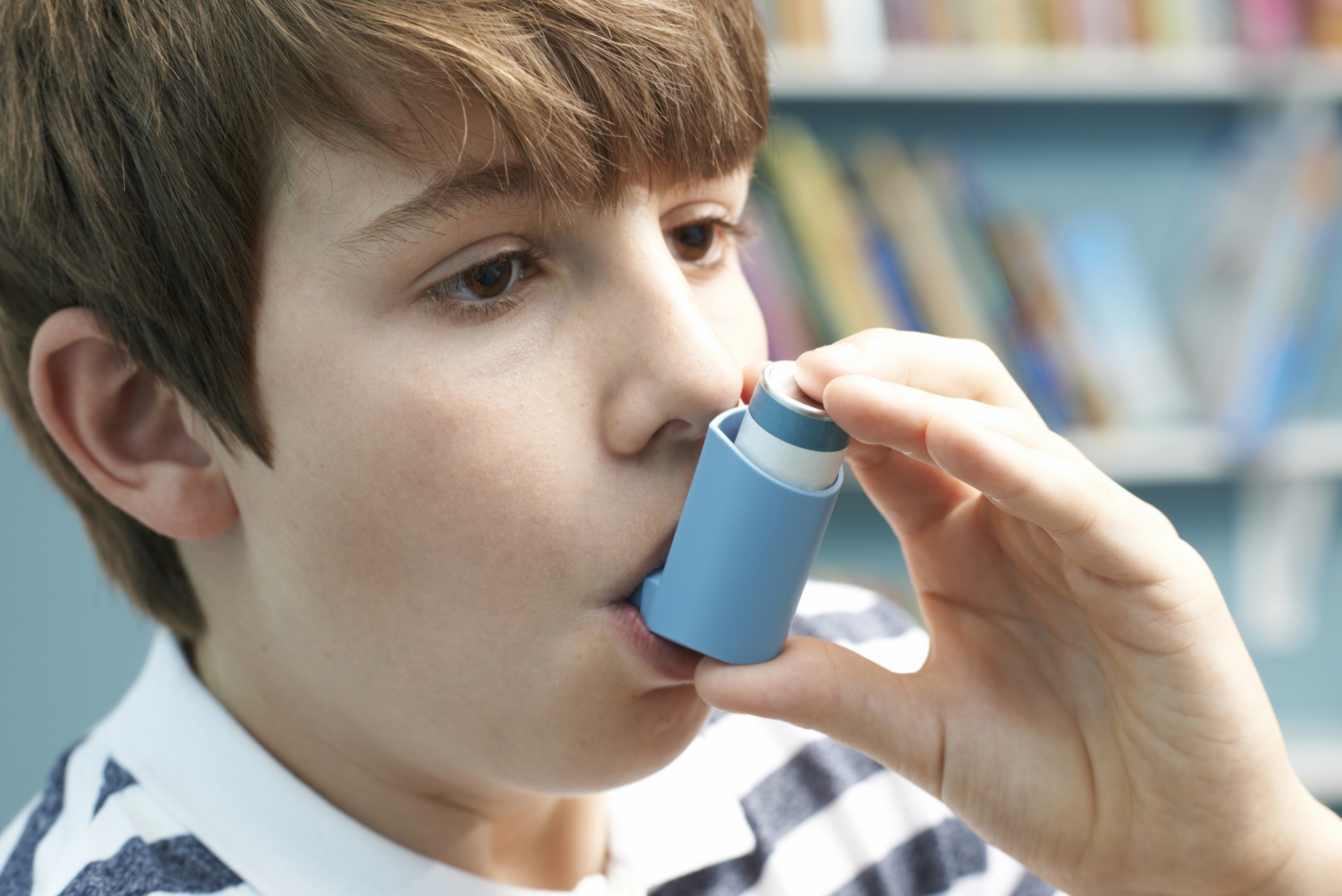 Boy Using Inhaler To Treat Asthma Attack School Mum